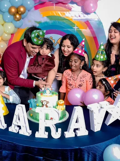 A thrilling 'Avengers' themed birthday party, with superhero cutouts, a cityscape backdrop, and dynamic balloon arrangements, ready for action.