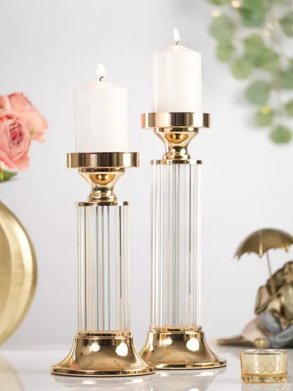 A pair of crystal and gold candle holders, showcasing luxury home decor items for the festive season.
