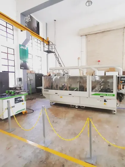 Our Jade 240 edge banding machine, an industrial tool that gives students experience in applying finished edges to panel products for a professional look.