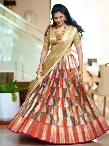 A full view of the client's multi-colored Kanchipuram half saree, showing how it blends traditional silk with a contemporary pattern.
