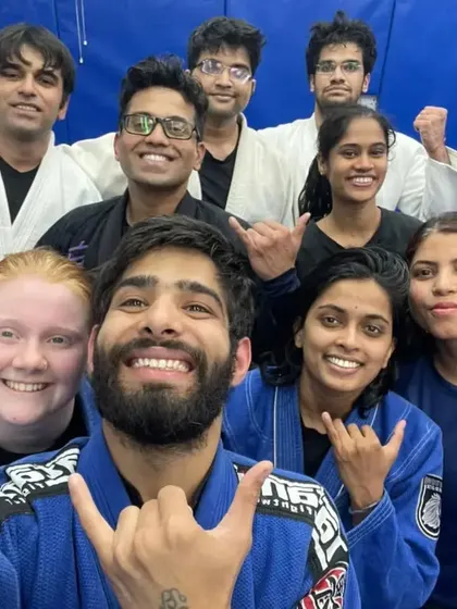 A diverse group of our Gi practitioners, all smiles after mastering a new submission.