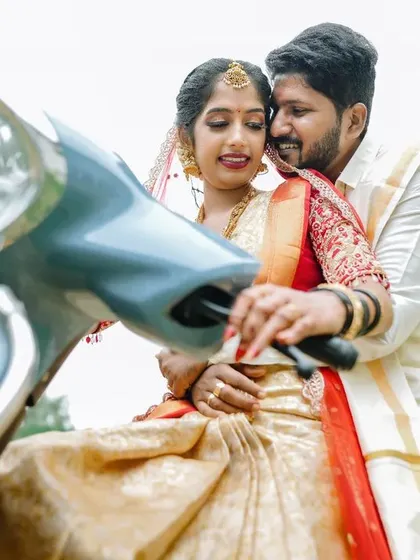 A duplicate of 31, a fun and creative shot of the newly married couple on a scooter.