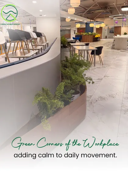 Green corners like this one at Accenture are strategically placed to add calm to high-traffic pathways. They serve as visual anchors that break the monotony of a typical office environment and improve the daily journey through the space.