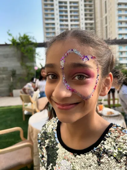 A heart full of glitter for this adorable party guest. Face painting is a wonderful way to make every child feel special.