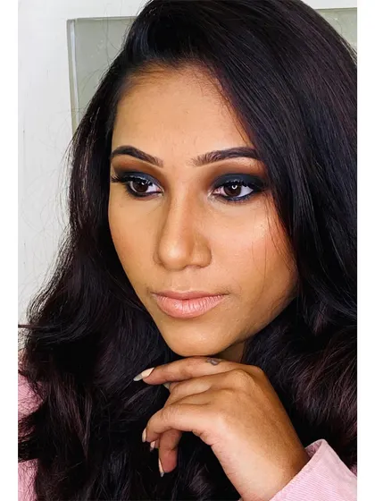 A classic smokey eye is always a great choice for a Sangeet or cocktail party. Here, I paired a dark, smudged-out liner with a soft nude lip for a chic and modern vibe.