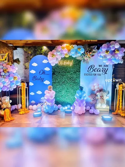 A complete view of the blue and pink teddy bear baby shower decor.