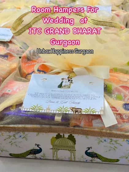These welcome hampers were created for a wedding at ITC Grand Bharat, Gurgaon, featuring a custom-designed basket with peacock motifs.