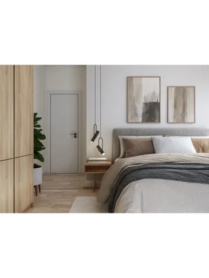 A minimalist bedroom that focuses on simplicity and natural textures. The light wood wardrobe, simple bed frame, and abstract art create a calm and peaceful environment.