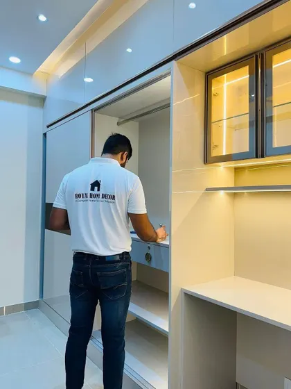 A closer look at the integrated study desk and wardrobe. The smooth sliding door reveals ample storage, while the desk area is well-lit and functional.