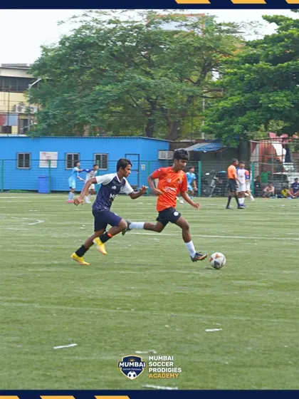 A player battles for possession, showing the fight and character of our team.