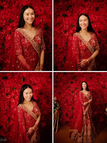 A collection of portraits of a beautiful bride in her red lehenga, set against a stunning wall of red roses.
