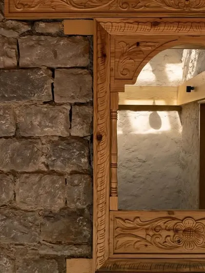 A close-up of the intricate Likhai woodwork, a traditional craft of the Rung community. We collaborated with local artisans to bring authentic cultural details into the museum's design.