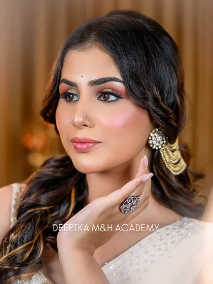 A close-up shot highlighting the flawless base makeup and the beautiful highlight on the cheekbones. The skin looks absolutely radiant.