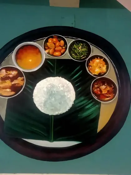 A mural painting of a traditional Indian thali served on a banana leaf. This piece celebrates the visual appeal and cultural significance of Indian cuisine.