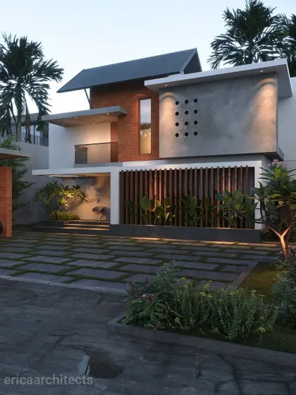A still image of the Malapuram project, providing a clear view of the material combination and the dramatic effect of the uplighting.