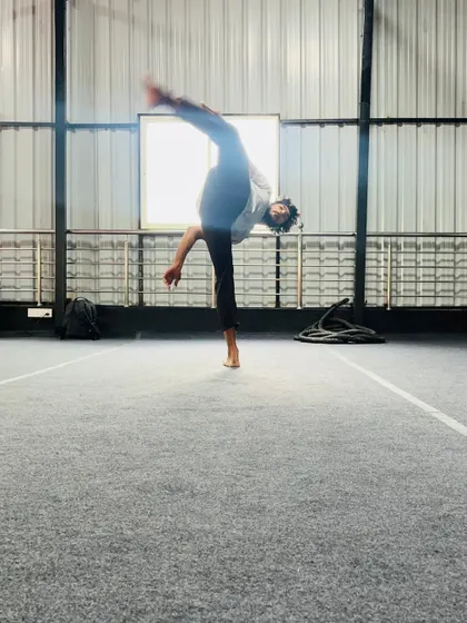 The dynamic motion of a spinning kick, captured mid-air. We teach the techniques for these advanced and visually impressive moves.