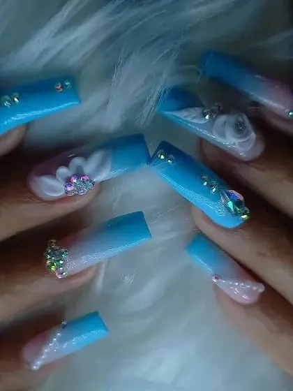 A different perspective of the blue 3D floral and rhinestone set, highlighting the sparkle and dimension.
