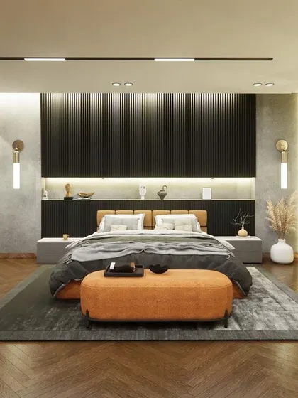 A wider shot of the ongoing bedroom project in Noida. The herringbone wooden flooring adds warmth and texture, contrasting beautifully with the cool grey walls and dark, modern furniture.