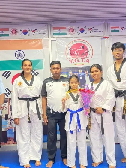 The team celebrating Naysha's victory. Her success motivates all our students to work harder.
