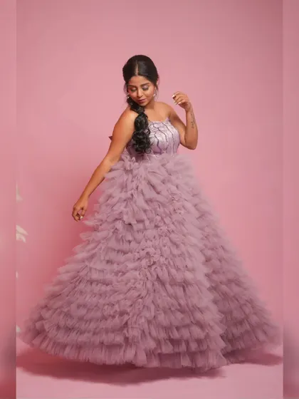 A dynamic shot showing the movement and flow of the light purple gown's skirt.