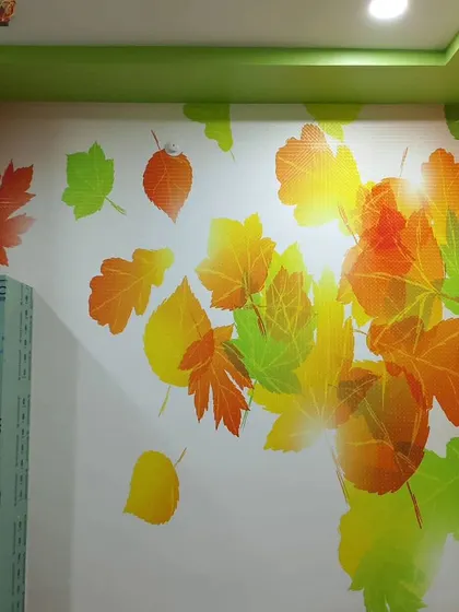 A bright and cheerful mural of colorful autumn leaves. This design is perfect for adding a pop of color to any room.