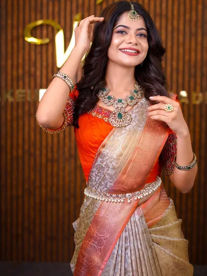Model Sanjana in a beautiful two-toned silk saree. The draping style is contemporary, with a focus on a clean silhouette that is perfect for a party or reception.