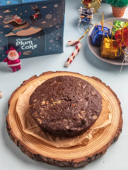 Our Premium Plum Cake is an upgrade on a classic, loaded with even more dried fruits and nuts. This round version is perfect as a centerpiece for your Christmas dessert table.