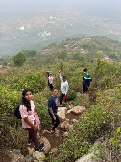 A group of friends making their way down a winding trail on the Kaiwara Betta trek. This trail is perfect for a weekend adventure with loved ones.