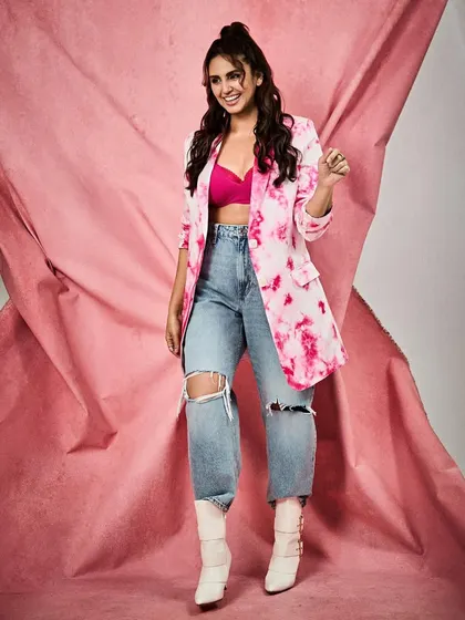 A joyful, candid-style shot of Huma. It shows that you can be both stylish and comfortable, and have fun with your look.