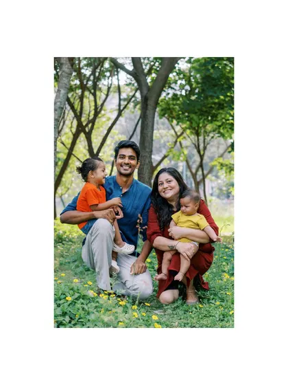 A family portrait in ethnic wear. The rich colors and the happy expressions make for a stunning photo.