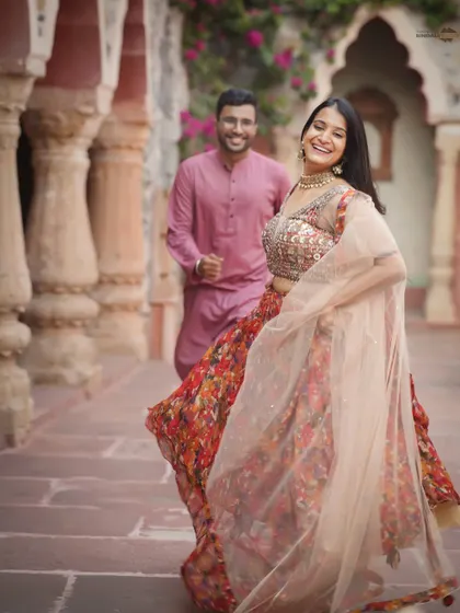 The best moments are the unscripted ones. The pure joy in her laughter and the movement in her lehenga capture the vibrant, candid energy I strive for in every shoot, set against a beautiful heritage backdrop.