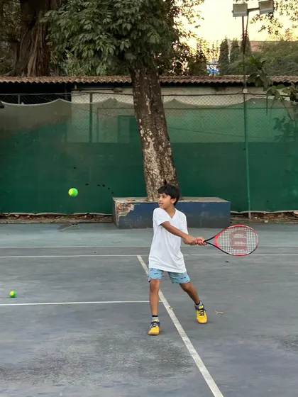 A young player hitting a clean forehand during a practice session. We focus on precision in every swing.