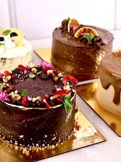 A collection of our healthy cakes. These are all gluten free, dairy free, and refined sugar free, but they don't compromise on flavor or texture. From a rich chocolate cake to a zesty lemon blueberry, there's a clean treat for everyone.