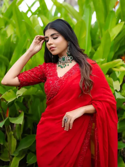 Another angle of this vibrant red saree, perfect for a modern woman who loves traditional wear.