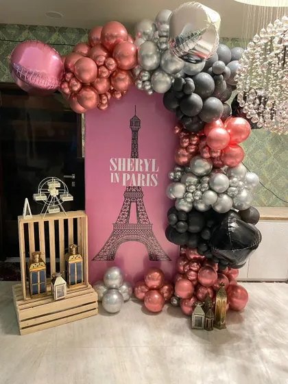 Another angle of the Paris-themed balloon decor, showing the mix of chrome, metallic, and foil balloons that bring the theme to life right in your home.