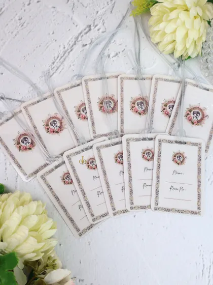 We also create custom luggage tags for wedding guests or as part of a destination wedding welcome kit. These feature the same floral crest design for a cohesive look.