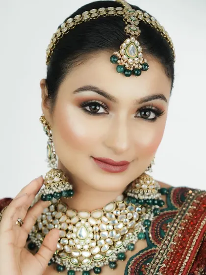 A close-up view highlighting the flawless skin texture and soft contour. My curriculum emphasizes skin preparation as the foundation for any stunning makeup look.
