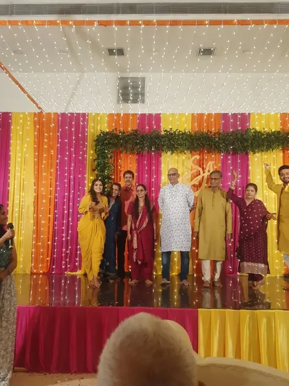 Our host engages with a family on stage during a fun activity. We ensure our events are interactive and give everyone a chance to be in the spotlight.