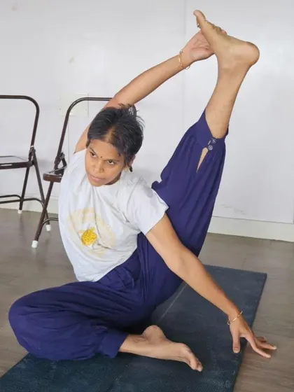 The intensity and grace of a deep twisting pose are captured here. Our TTC program guides students to explore their limits safely and mindfully.