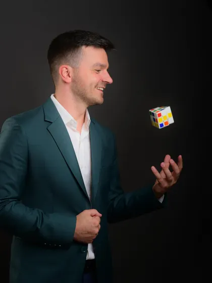 Another take on the creative prop shot. The motion of the floating Rubik's cube adds a dynamic and playful element to the corporate portrait.