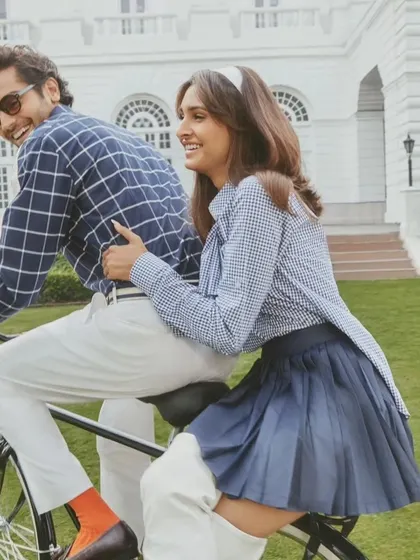 A candid, joyful moment from the S&N by Shantanu Nikhil shoot. The natural-looking hair and makeup were designed to hold up during an active outdoor shoot while looking effortlessly beautiful.