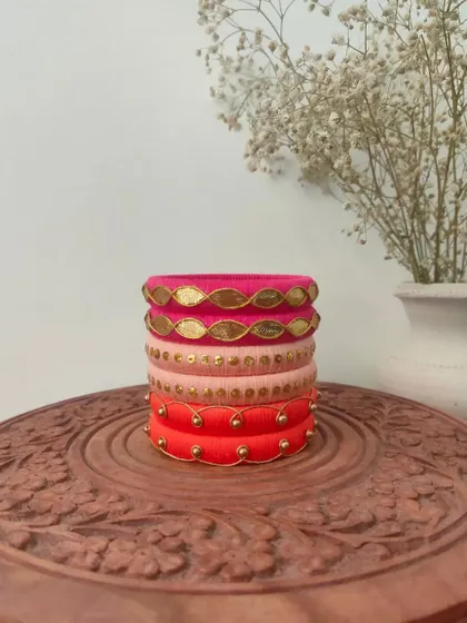 A beautiful set of bangles in shades of pink and red. I used different techniques here, including gota patti and simple beadwork, to create a varied and interesting stack.