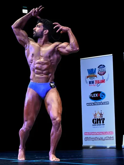 A classic pose from the INBA World Natural Bodybuilding contest in New Zealand. This is the level of conditioning I help my athletes achieve.