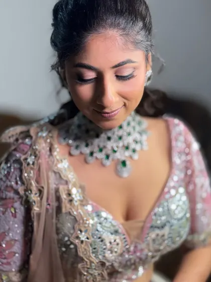 A beautiful close-up of this bride's reception makeup. The soft, glowing skin and defined eyes are the stars of this minimal glam look.