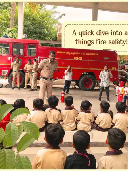 A quick dive into all things fire safety. A firefighter explains the equipment to an engaged audience of our little learners, with a fire truck as the backdrop.