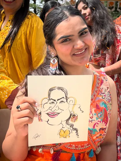 Her beautiful smile is perfectly captured in this fun caricature from a wedding event in Mussoorie.