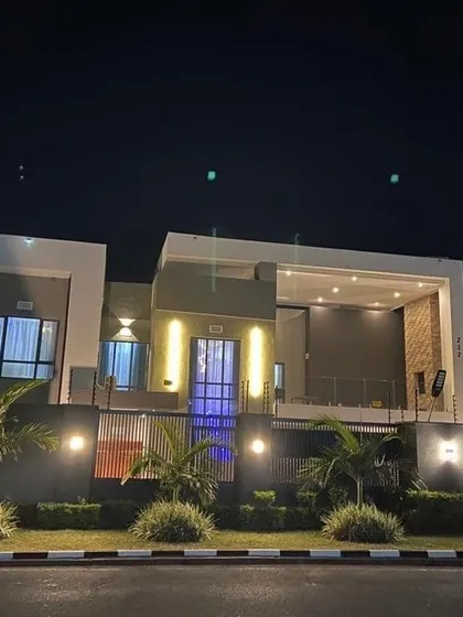 A home's personality shines brightest at night. We use strategic, multi-layered lighting to accentuate the architectural lines, create dramatic shadows, and give the residence a warm, inviting glow that stands out after dark.
