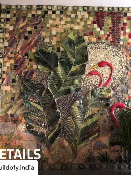 A close-up of the flamingo mural, showing the rich textures and colors. The artist used a mix of ceramic tiles and custom-molded cement pieces to create this vibrant, three-dimensional artwork.