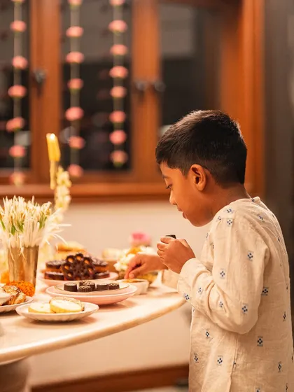 Our littlest and most honest critic, Ari, getting ready to sample the Diwali treats. His approval means everything.