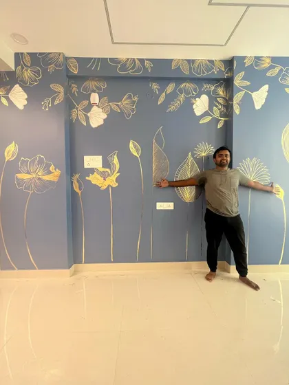 Here I am with another gold foil creation. The design on the dusty blue wall is elegant and fills the large space with artistic flair. The client was thrilled with the outcome!